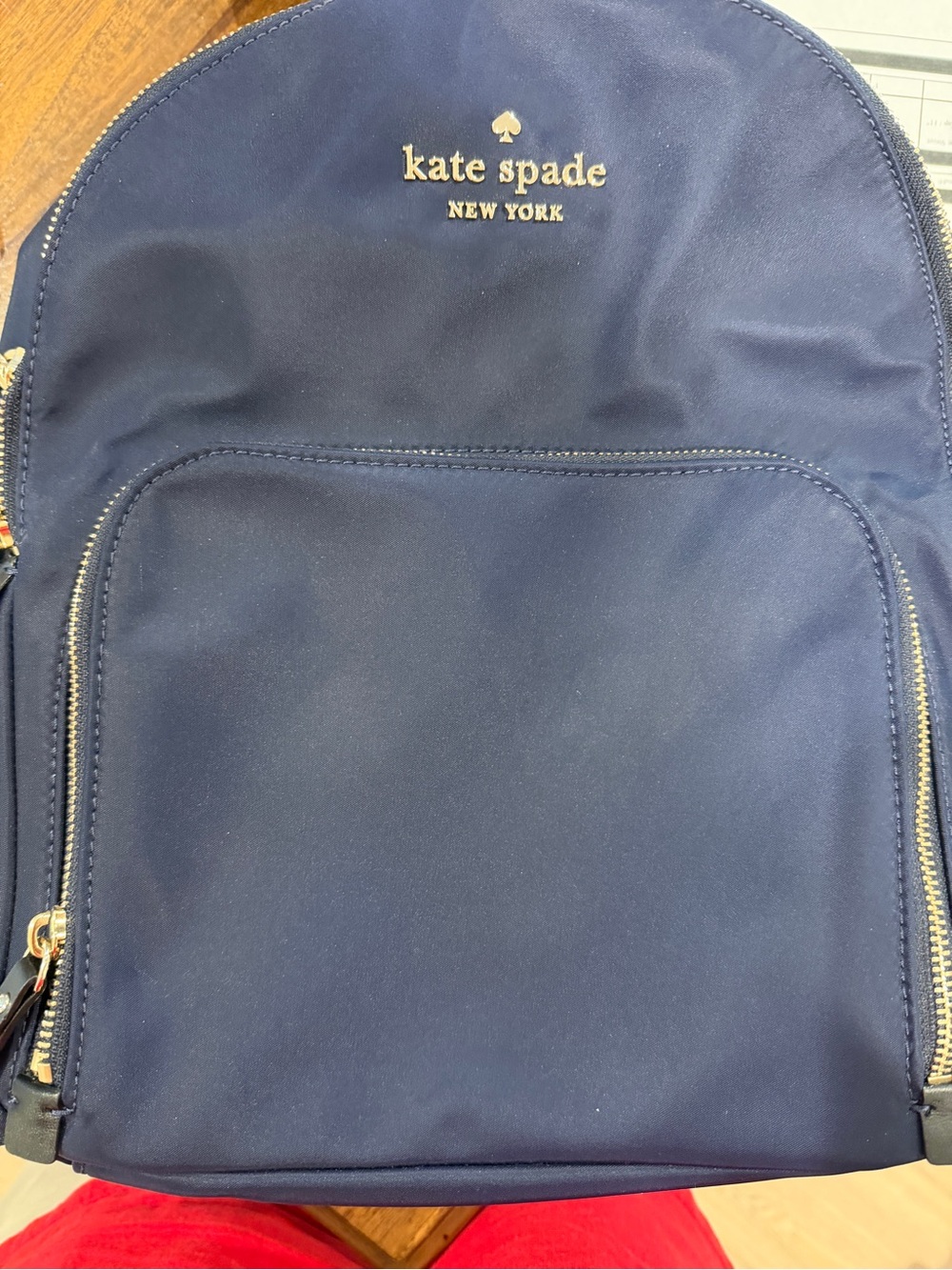kate spade navy blue nylon backpack with gold hardware